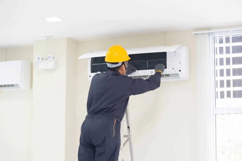 Air conditioning Sarasota technician installing new HVAC system