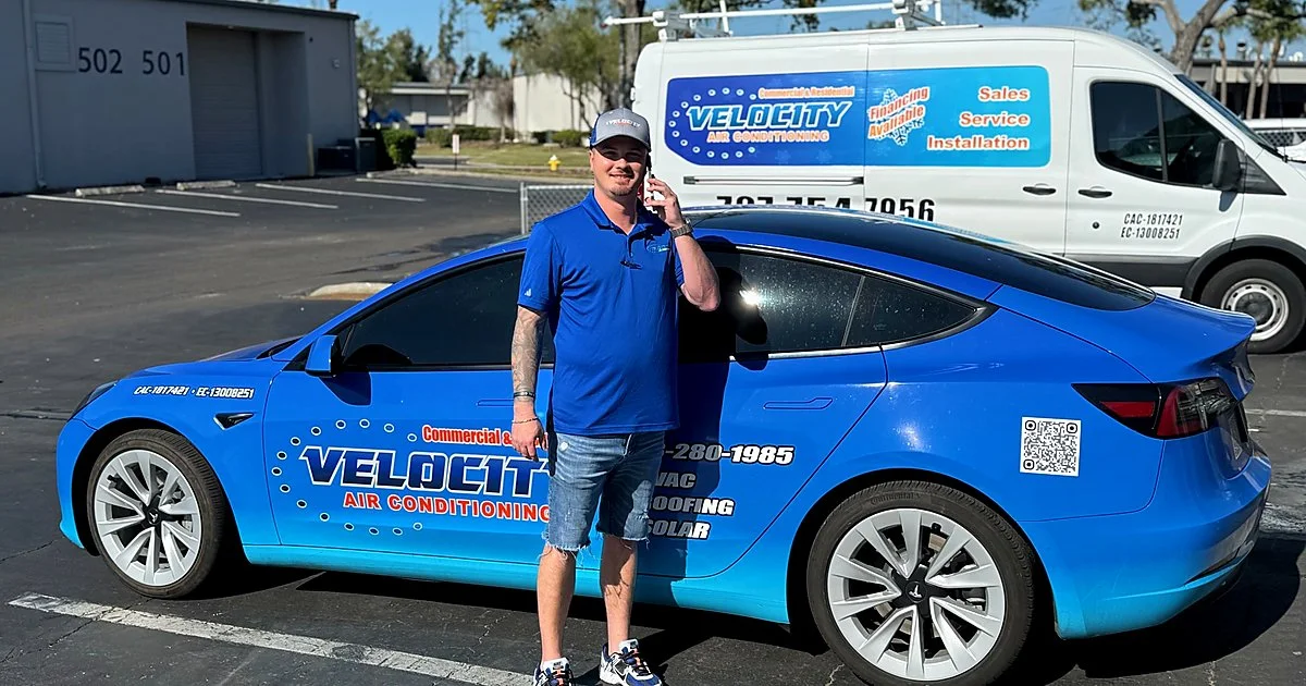 Velocity AC technician diagnosing a residential HVAC system in 